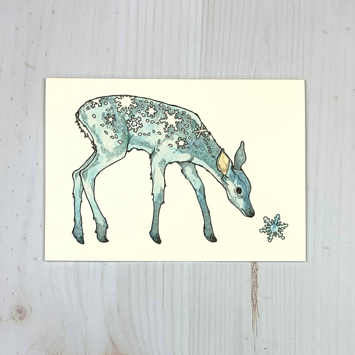 Watercolor fawn with snowflake spots and winter art design