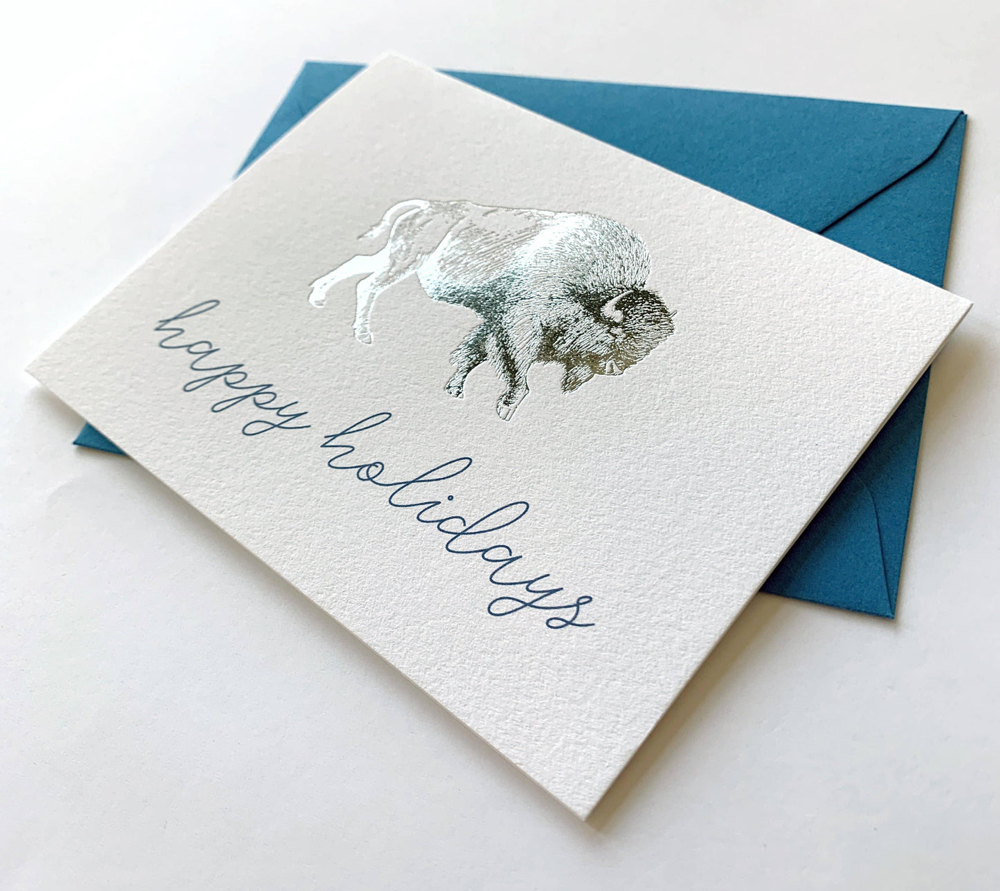 Happy Holidays card with silver buffalo design and blue envelope, perfect for Native art enthusiasts