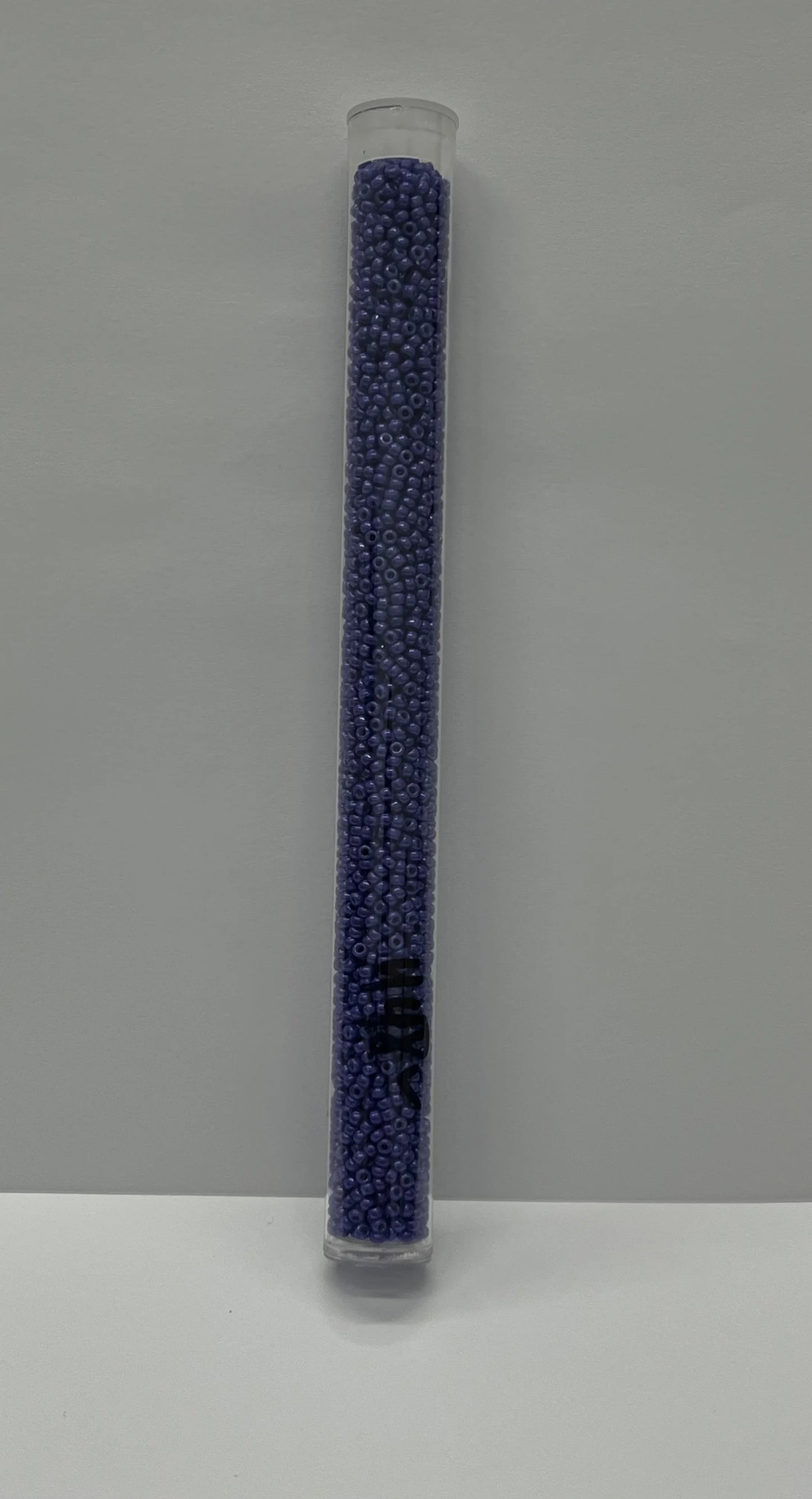 Purple seed beads in clear tube for Native American arts and crafts supplies