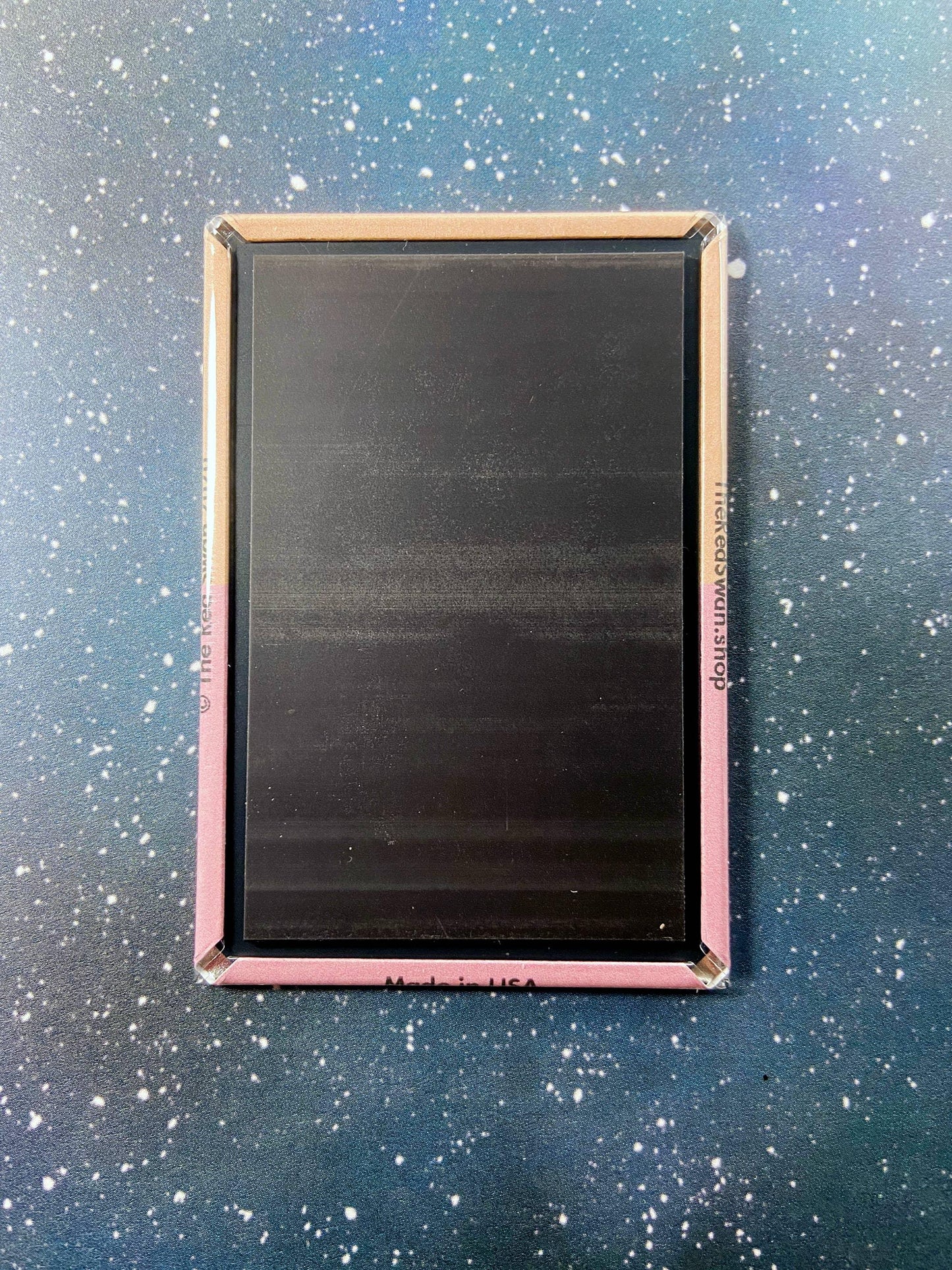 Black rectangular art panel with pink frame, 'Made in USA' text, on starry blue background