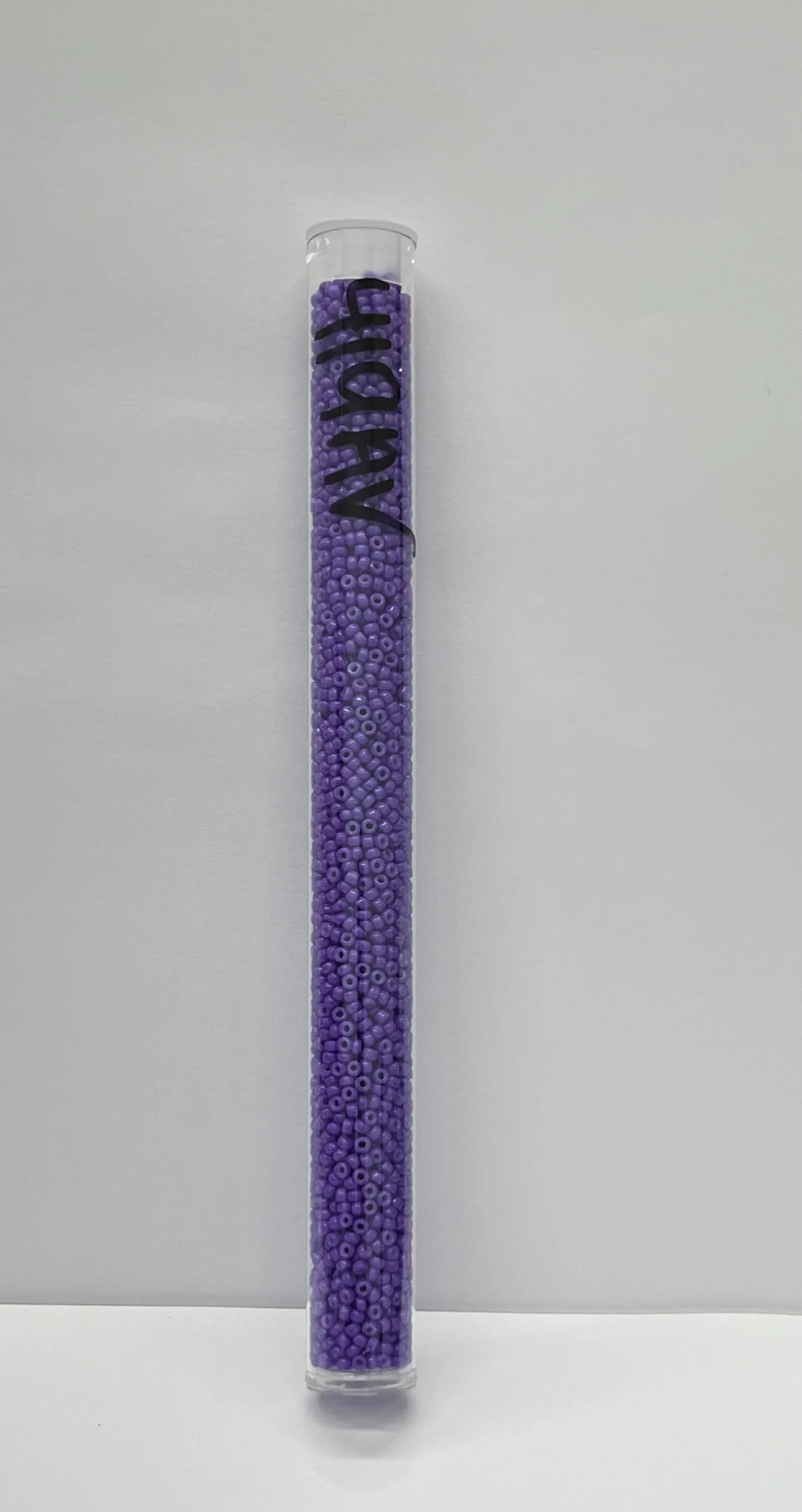 Purple seed beads in clear tube for Native American crafts and beadwork