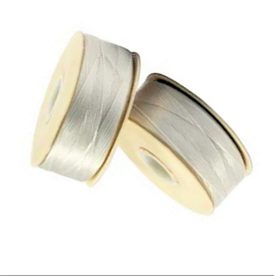Silver satin ribbon spools for Native American craft and traditional clothing projects
