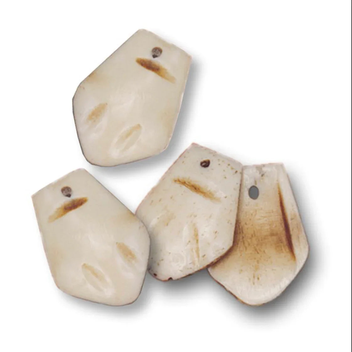 Hand-carved bone pendants with natural markings, ideal for Native American art and craft projects.