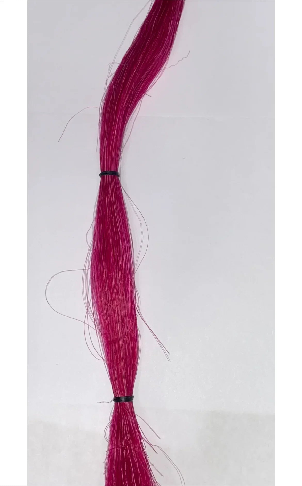 Vibrant magenta synthetic hair bundle for Native American crafts and traditional regalia