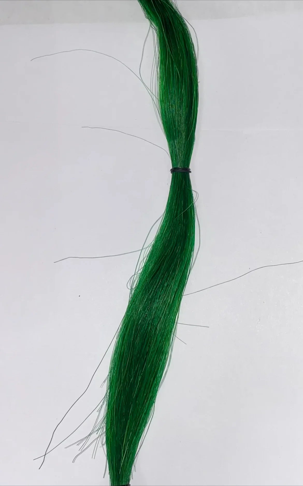 Vibrant green synthetic hair for Native American crafts and traditional regalia, bundled with black tie.