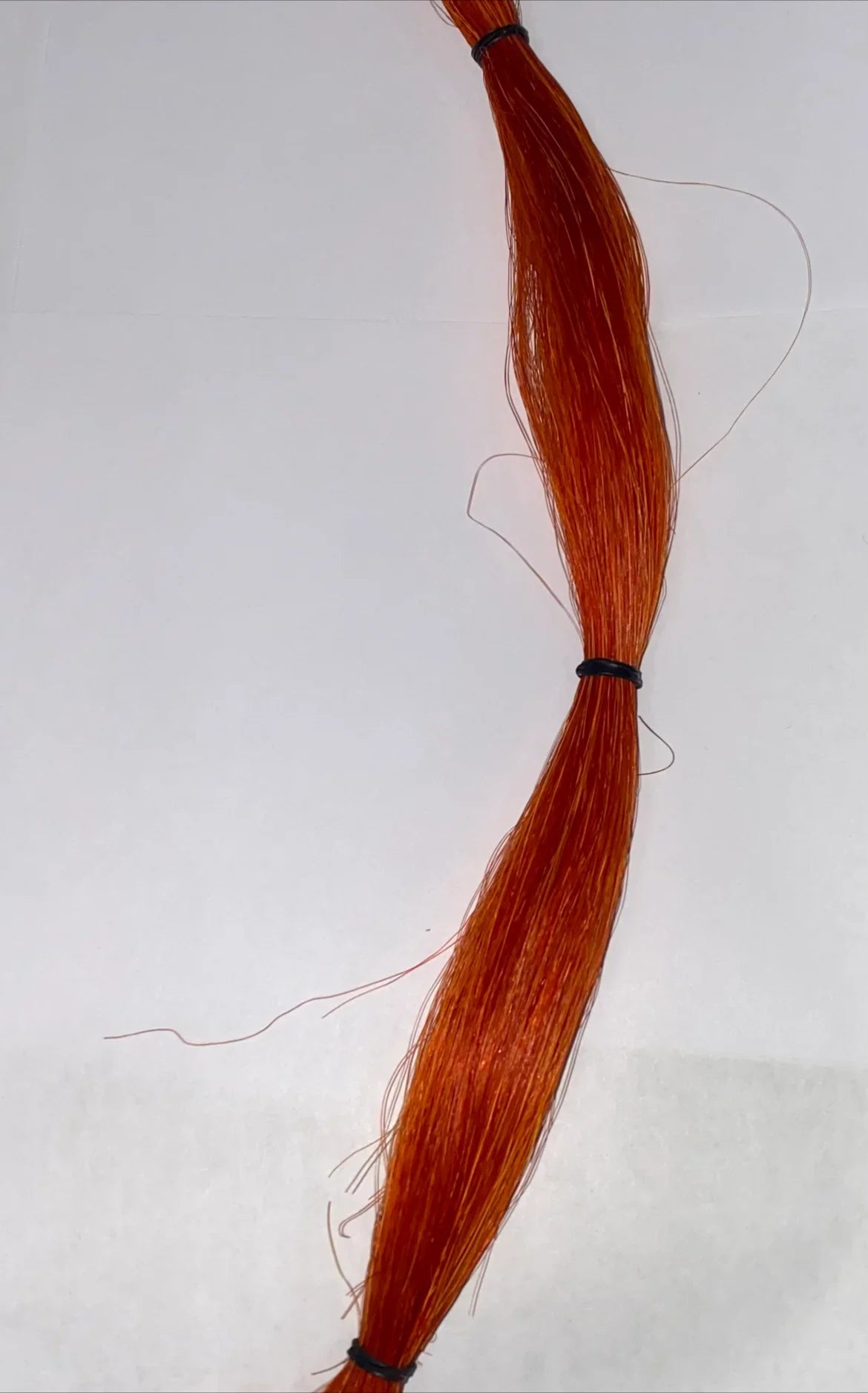 Rust-colored synthetic hair bundle for Native American crafts and traditional regalia