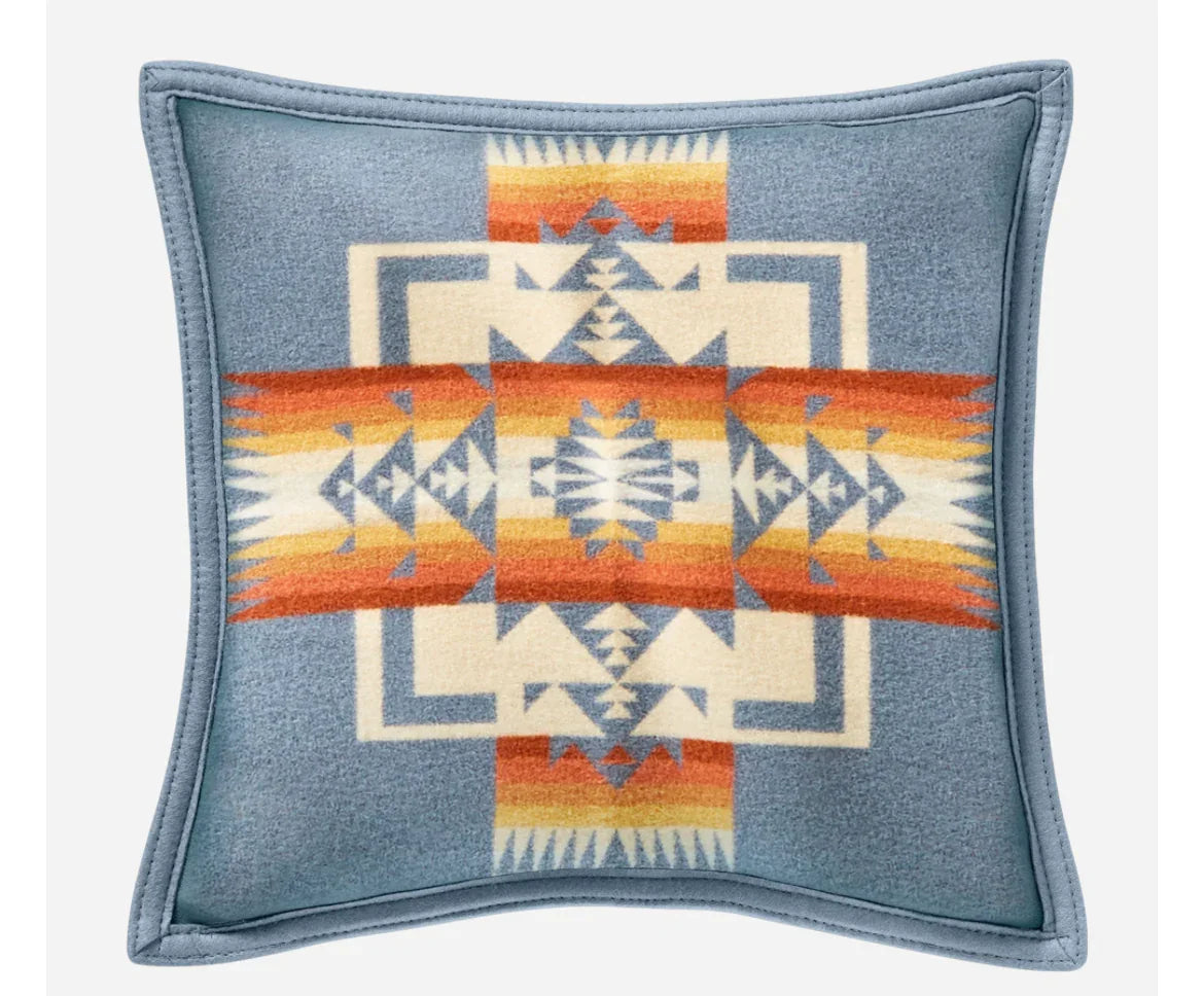 Native American patterned throw pillow with geometric design in blue, orange, and cream tones