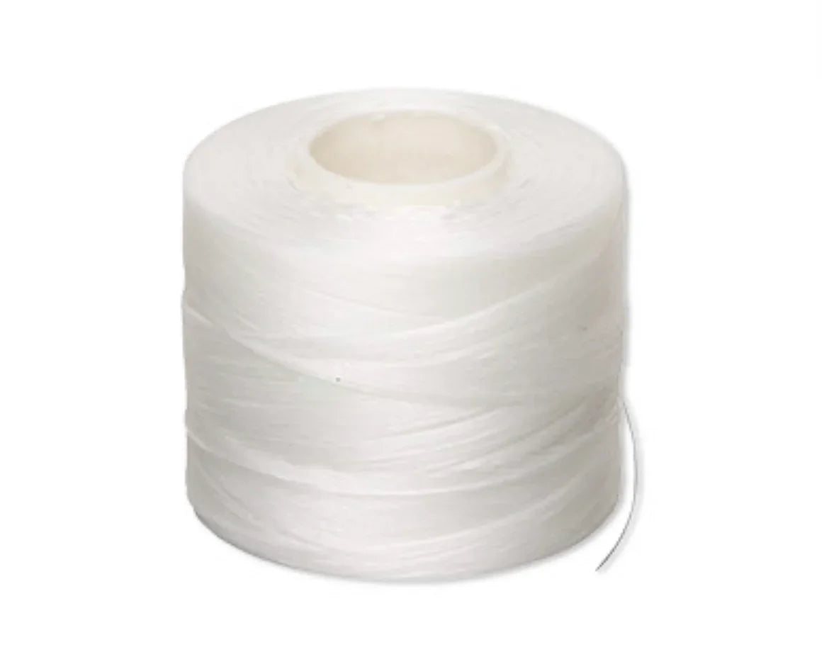 White nylon thread spool for Native American beadwork and craft projects