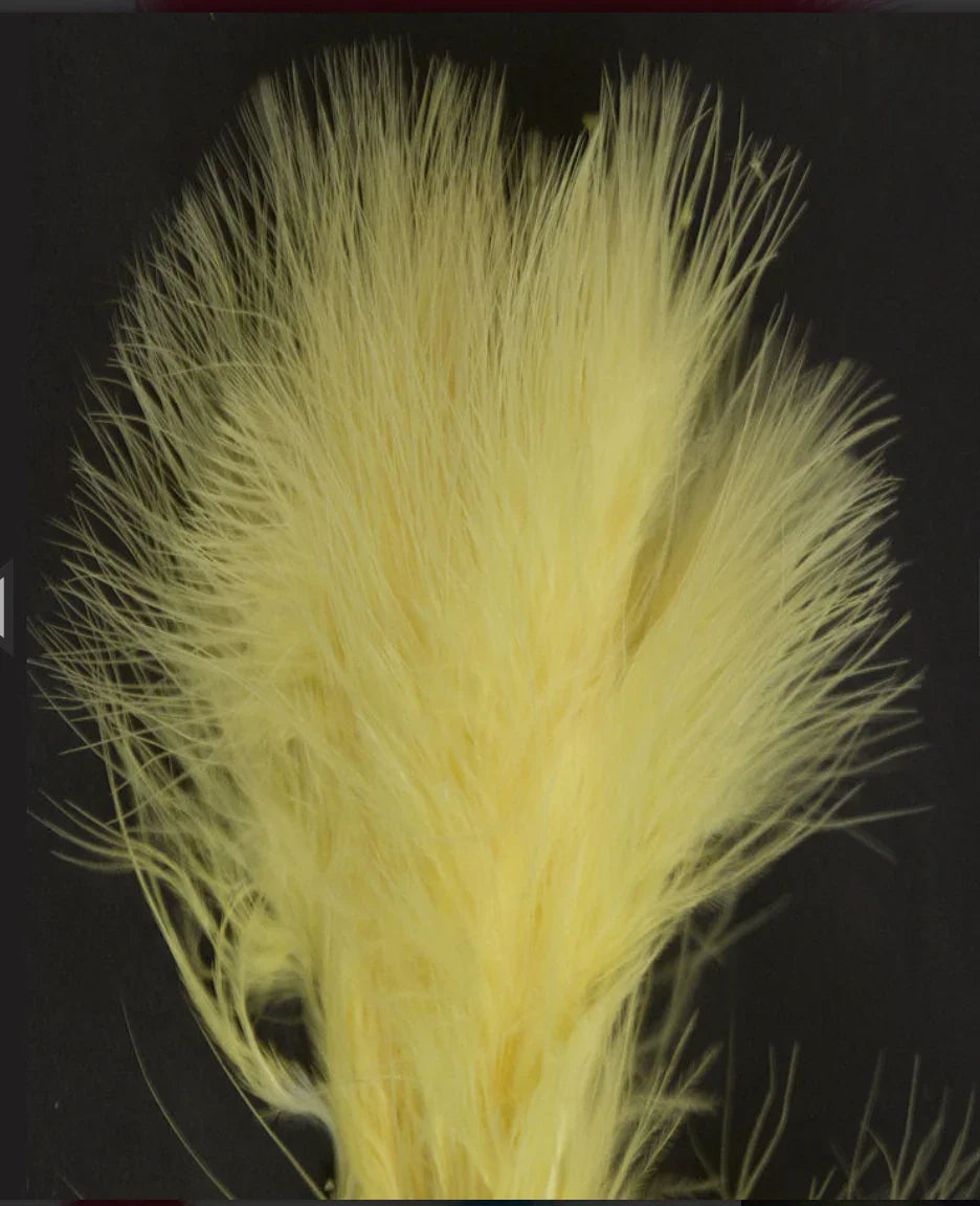 Soft yellow craft feathers for Native American art and traditional clothing projects
