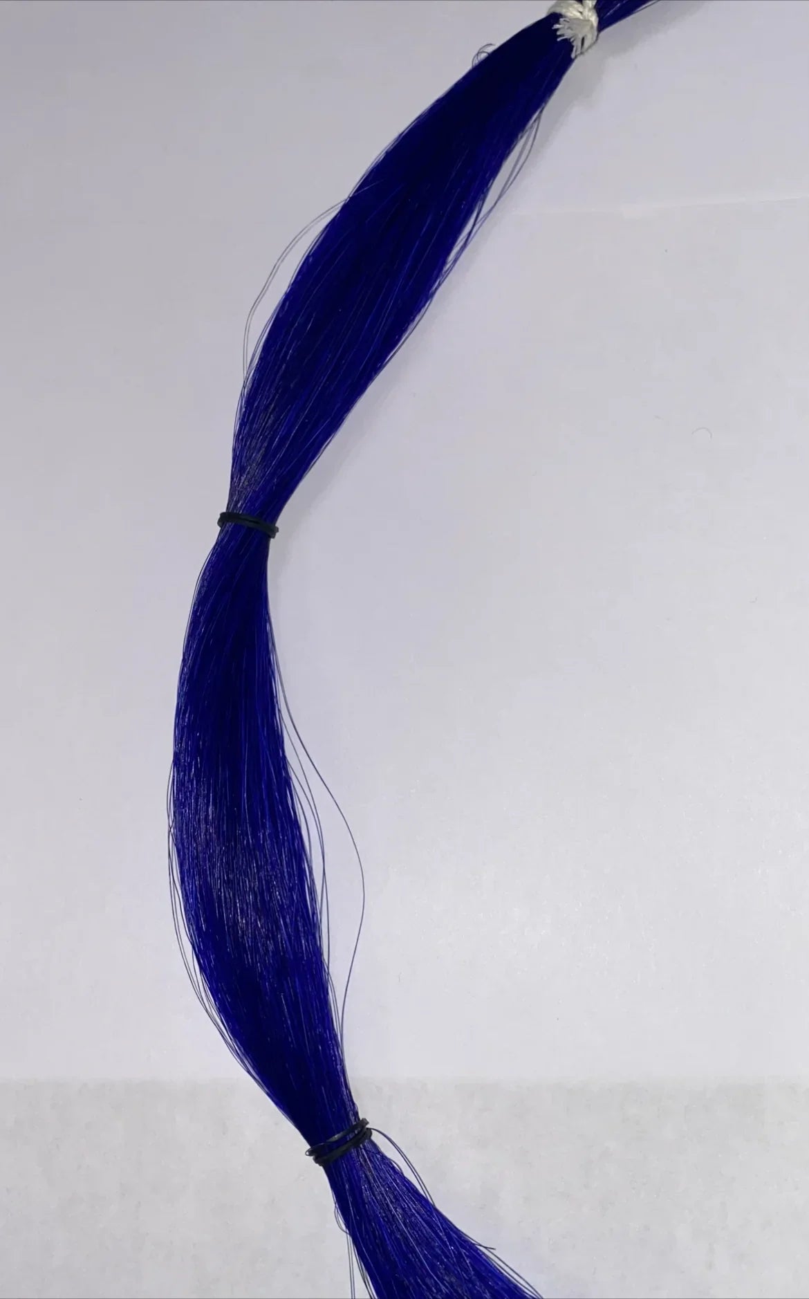 Vibrant blue synthetic hair for Native American crafts and traditional regalia, bundled with ties