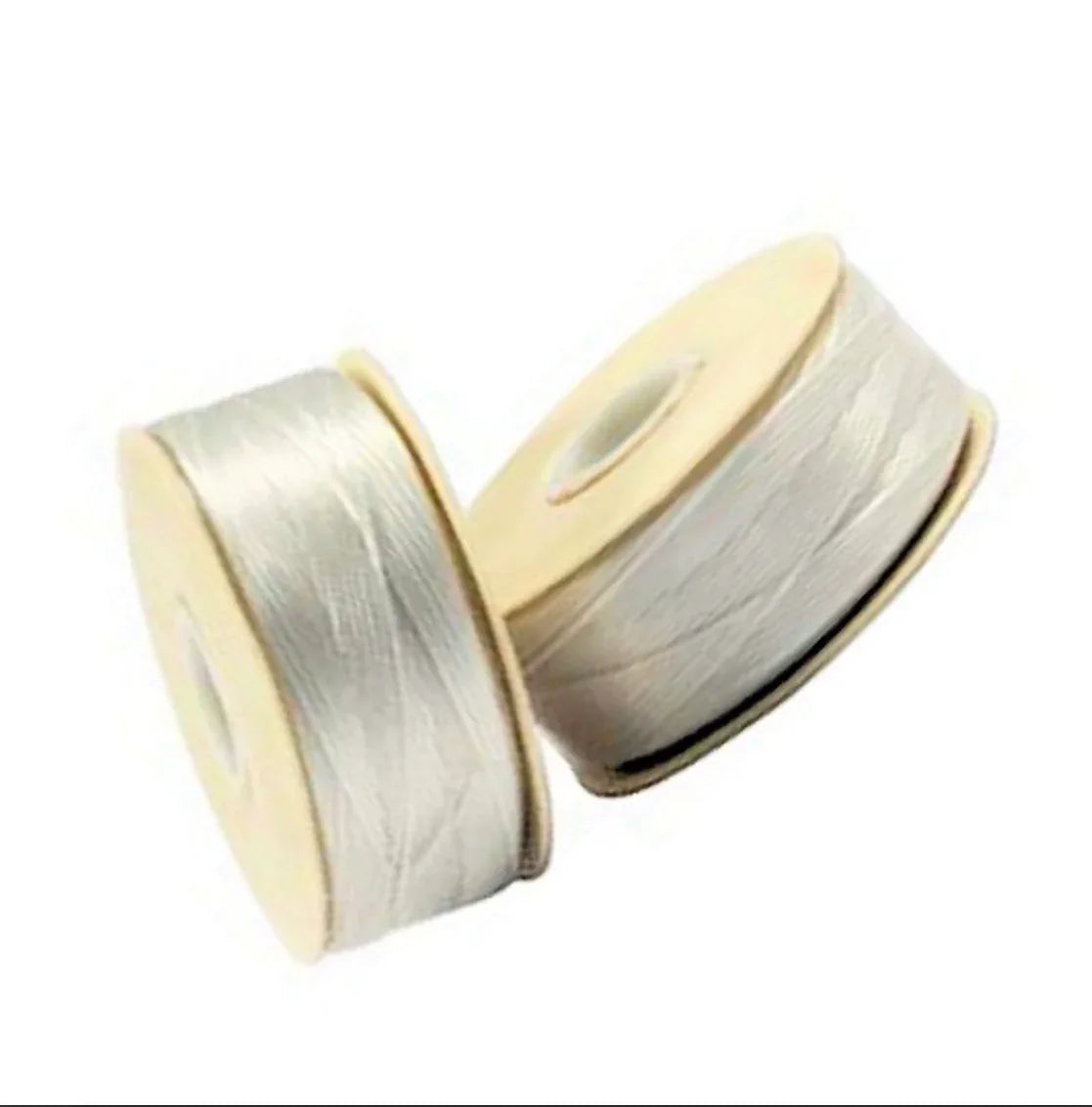 Silver satin ribbon spools for Native American crafts and traditional clothing projects