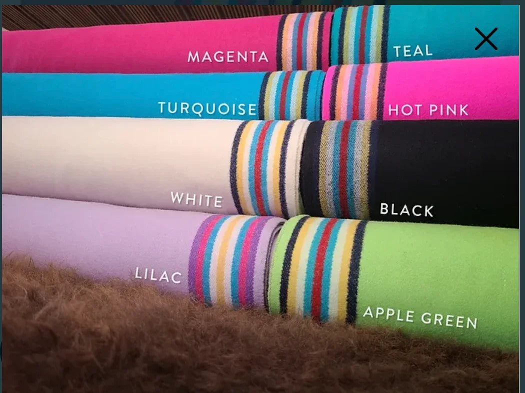 Colorful fabric rolls for Native art crafts: magenta, teal, turquoise, hot pink, white, black, lilac, apple green