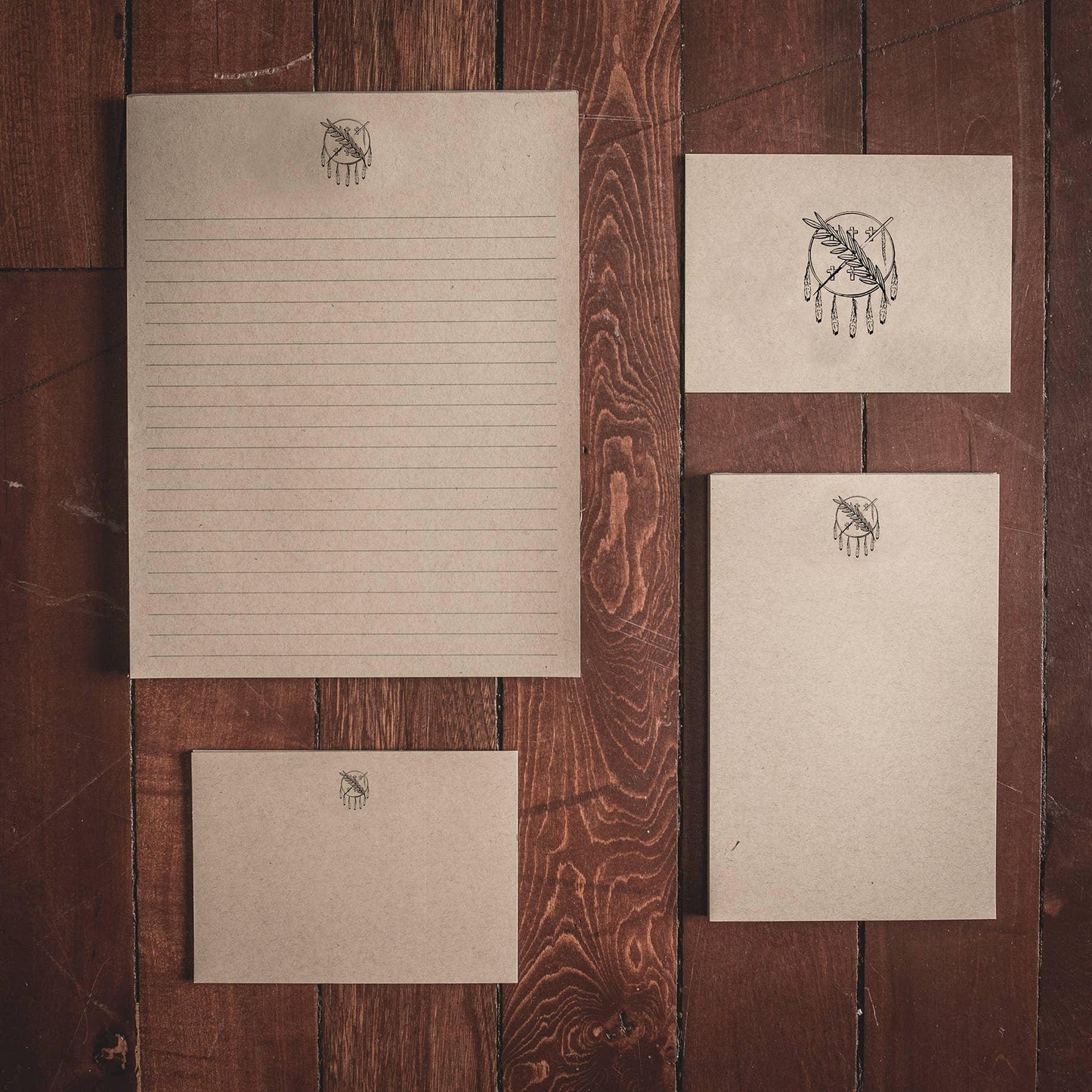 Native-inspired stationery set with dreamcatcher design on rustic wood, perfect for traditional crafts and art supplies