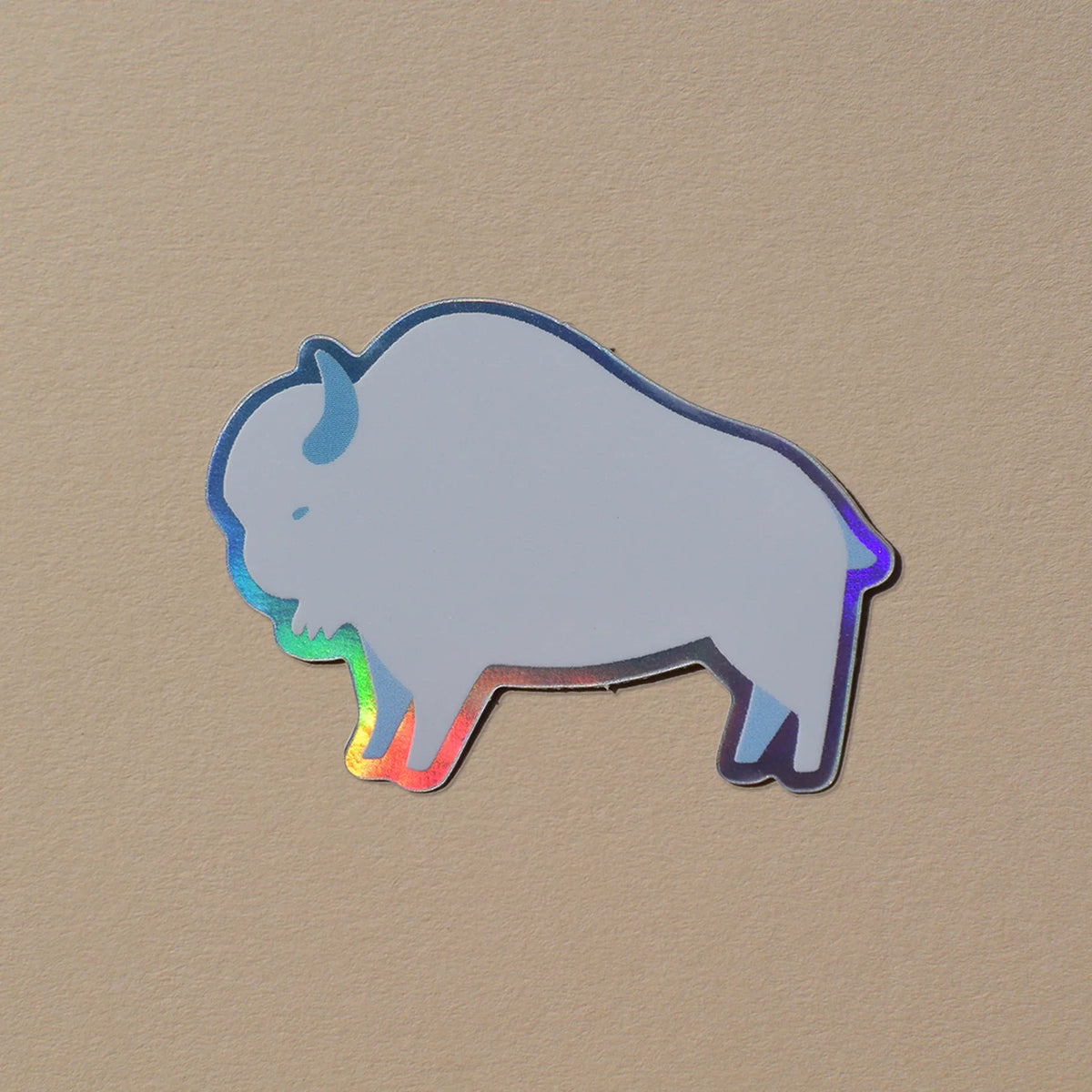 Holographic buffalo sticker with iridescent rainbow edges, ideal for Native art crafts and traditional decor.