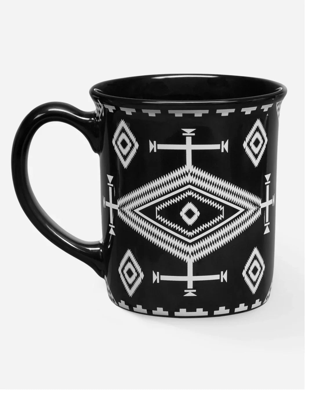 Black mug with white Native American geometric patterns, featuring diamond and cross motifs.