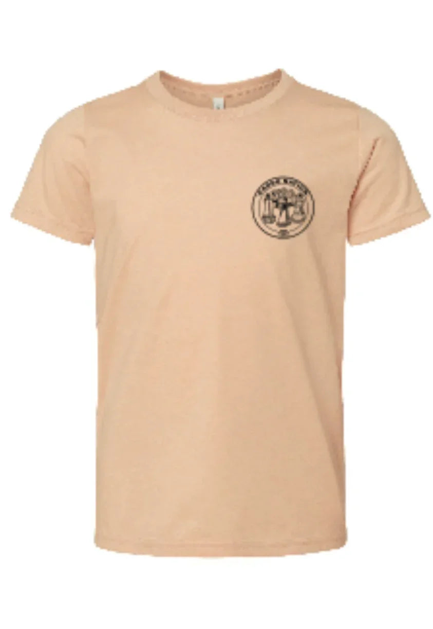 Peach t-shirt with circular Native art emblem, ideal for traditional crafts and cultural apparel.