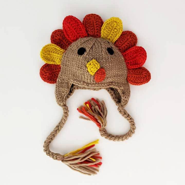 Hand-knit turkey hat with colorful feathers and tassels, perfect for Native art crafts and traditional clothing projects.