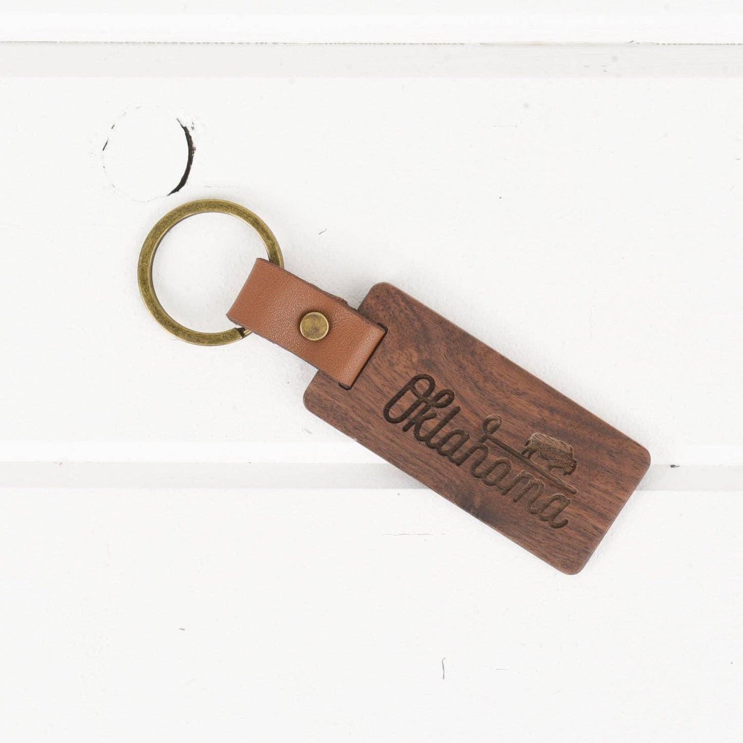 Wooden Oklahoma keychain with bison engraving, leather strap, rustic souvenir for Native art lovers