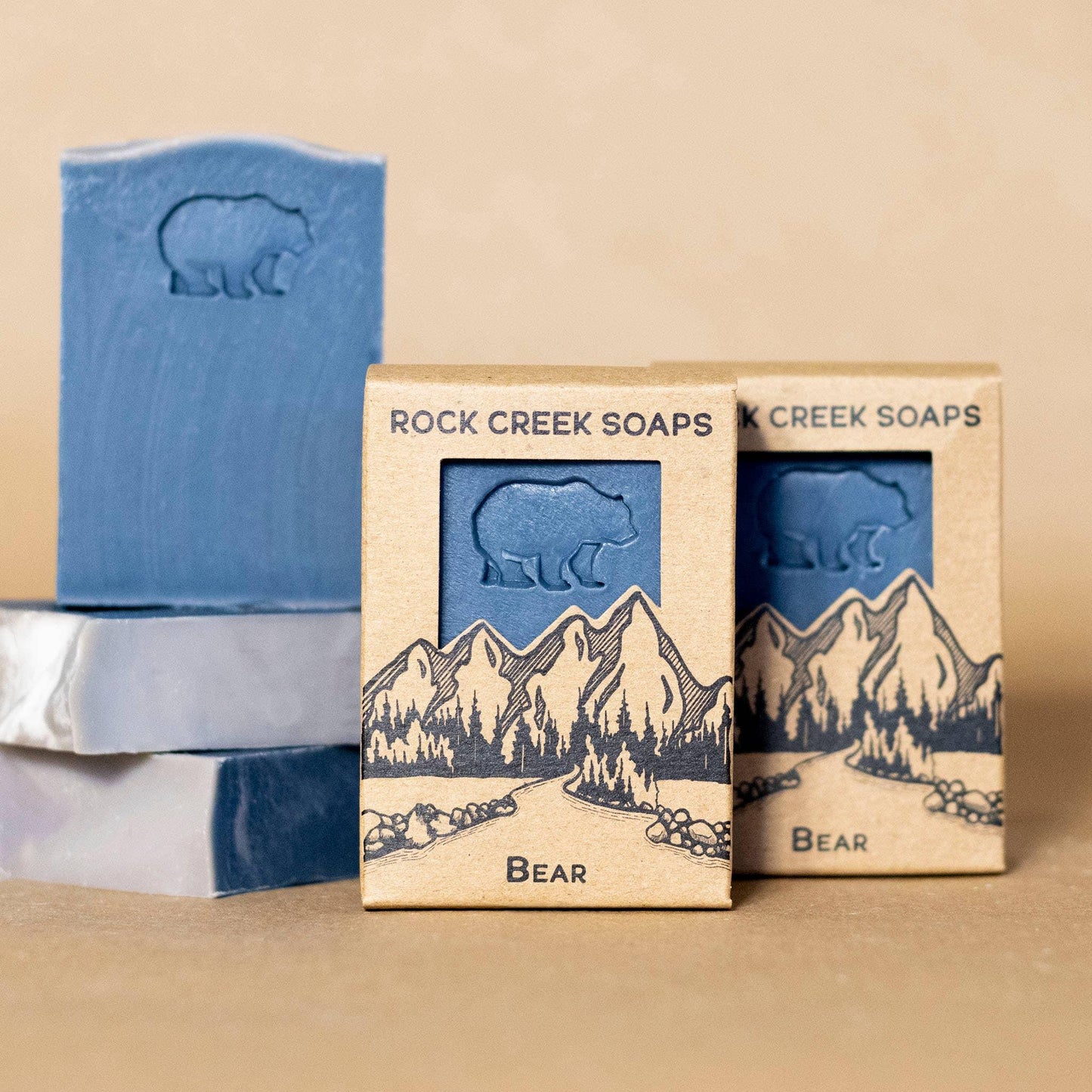 Blue bear-themed soap bars with mountain packaging, Rock Creek Soaps Bear collection