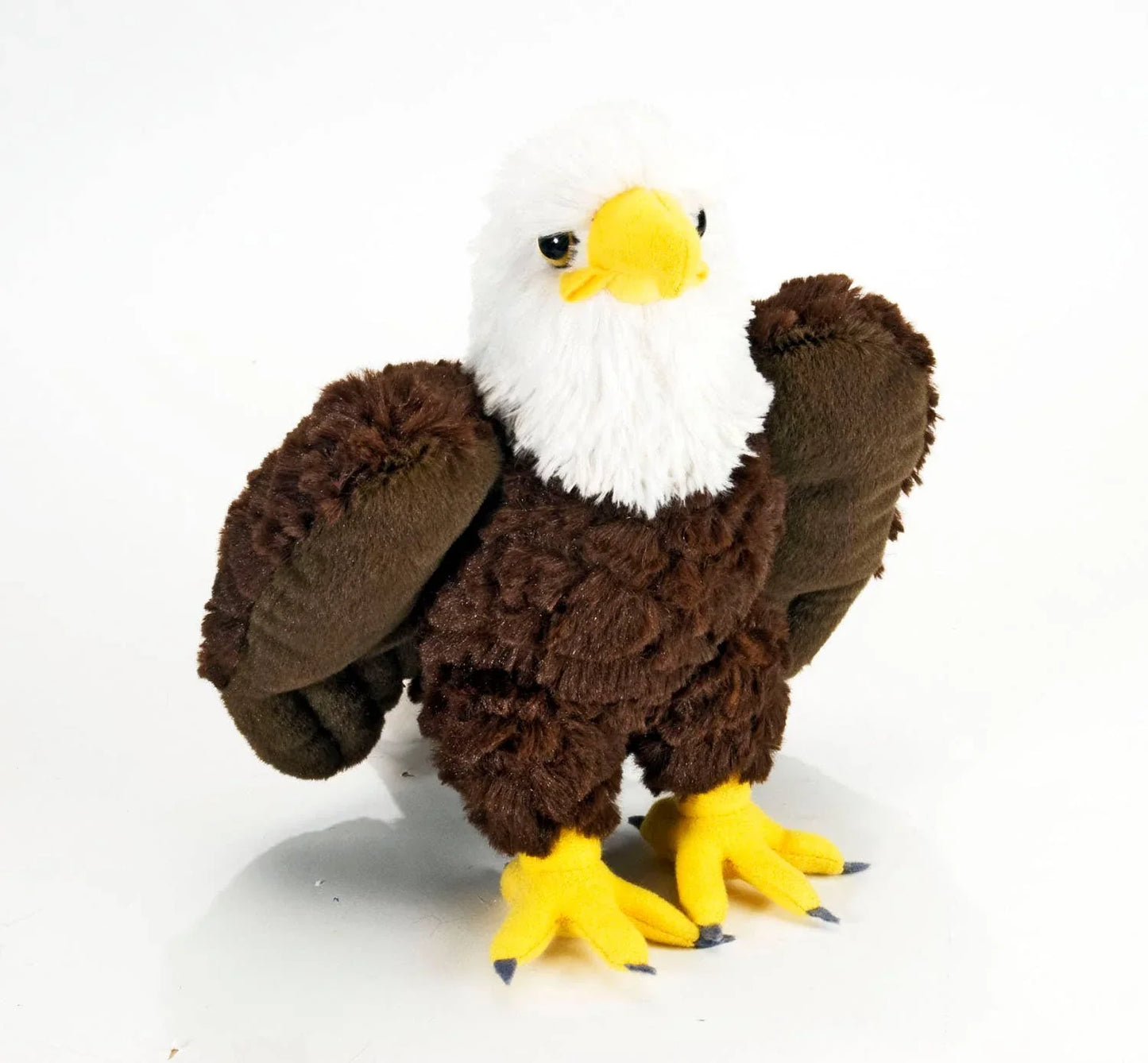 Plush bald eagle with brown wings, white head, yellow beak and feet, for Native art crafts