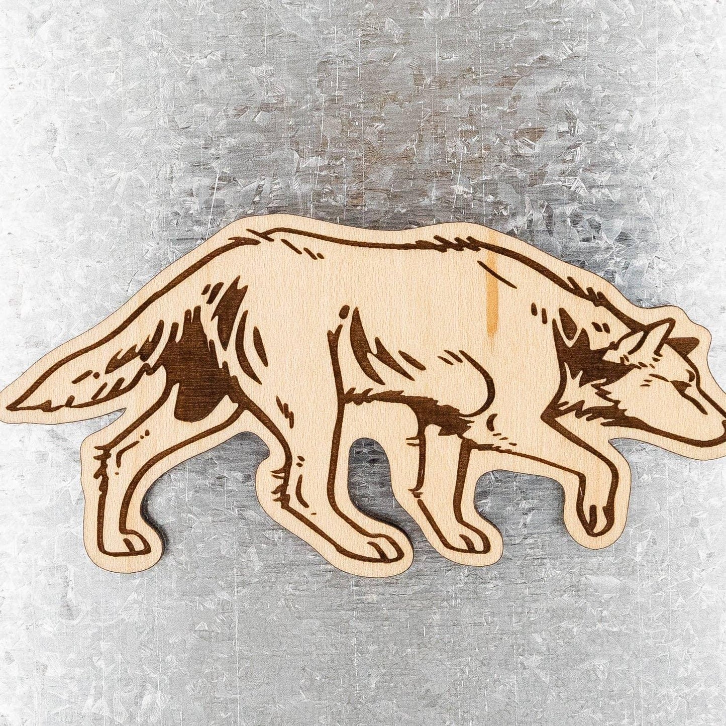 Laser-cut wooden wolf silhouette for Native art crafts and decor