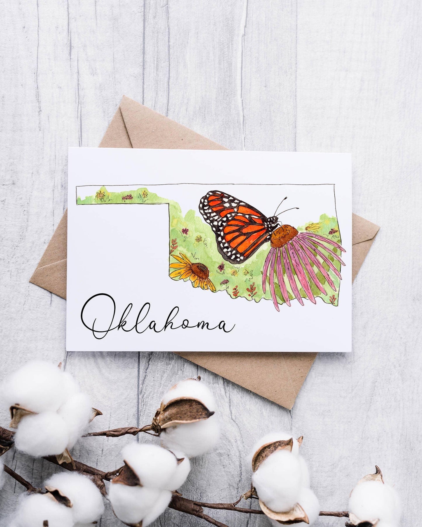Oklahoma state outline card with monarch butterfly and wildflowers, cotton accents, Native art inspired