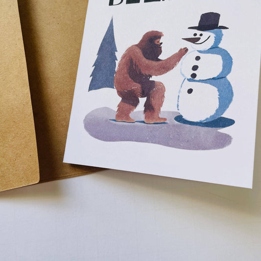 Bigfoot Building a Snowman Christmas Card : Brown Kraft Paper