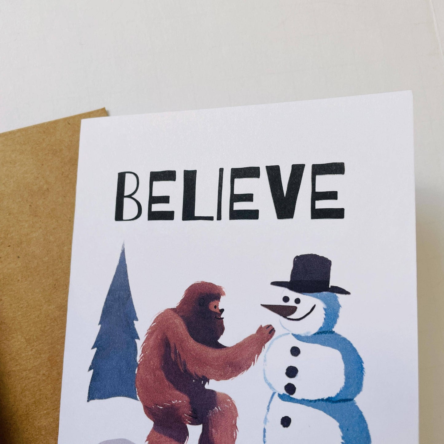 Bigfoot Building a Snowman Christmas Card : Brown Kraft Paper