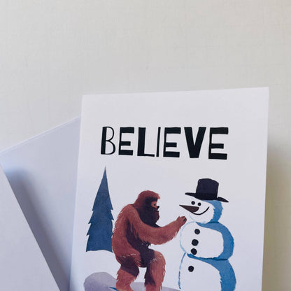 Bigfoot Building a Snowman Christmas Card : Brown Kraft Paper
